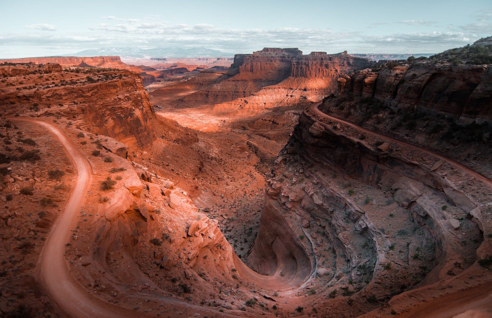 Moab desert valley with canyon and mesas in the background red rock